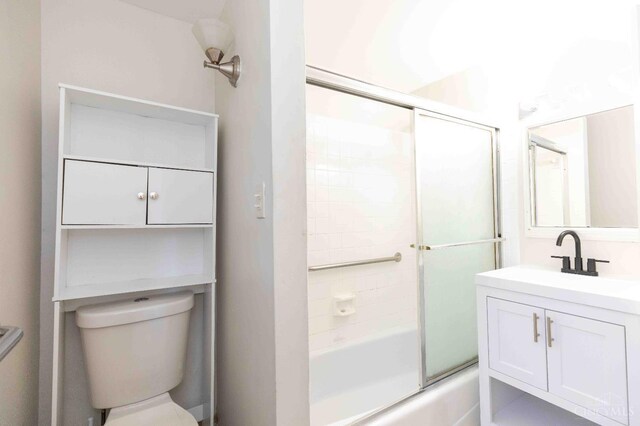 6785 Marvin Ave, North College Hill, OH 45224 - full bath featuring vanity, shower / bath combination with glass door, and toilet