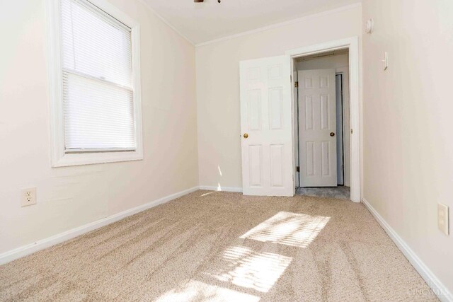 6785 Marvin Ave, North College Hill, OH 45224 - carpeted empty room with crown molding and baseboards