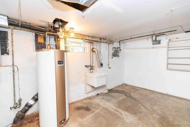 6785 Marvin Ave, North College Hill, OH 45224 - below grade area with gas water heater, a sink, and gas meter