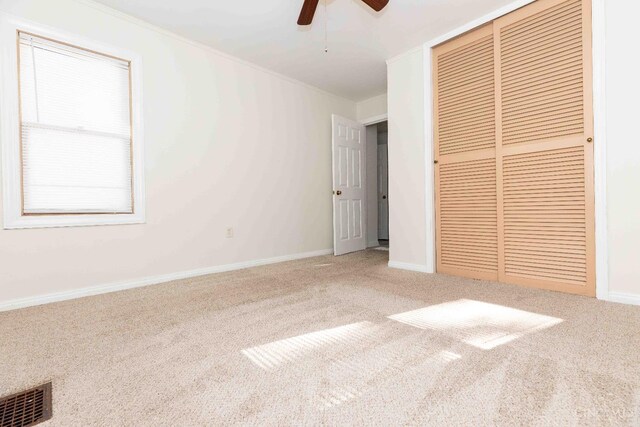6785 Marvin Ave, North College Hill, OH 45224 - unfurnished bedroom featuring carpet, a closet, baseboards, and crown molding