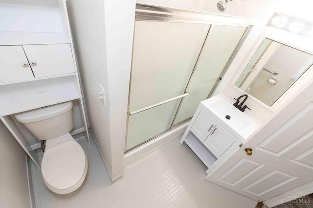 6785 Marvin Ave, North College Hill, OH 45224 - full bathroom with a shower with door, toilet, vanity, and tile patterned flooring