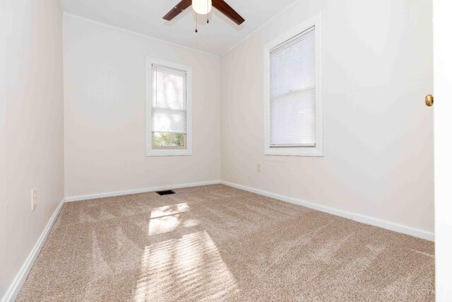 6785 Marvin Ave, North College Hill, OH 45224 - carpeted empty room with crown molding, a ceiling fan, and baseboards
