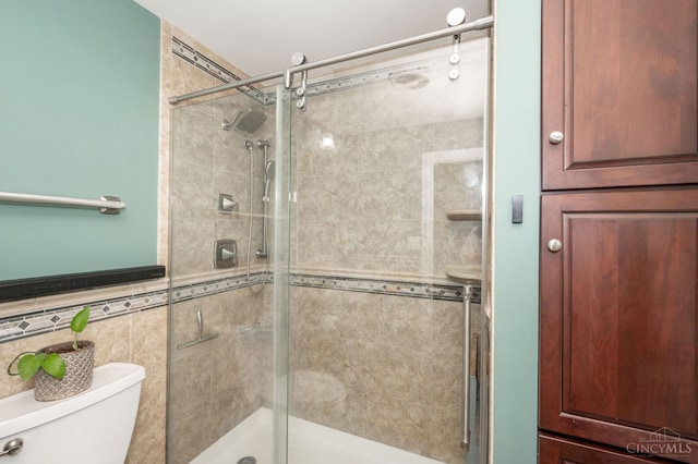 6290 Ludlum Rd, Salem Twp, OH 45152 - bathroom featuring a stall shower, toilet, and wainscoting