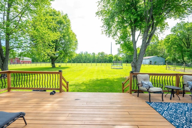 6290 Ludlum Rd, Salem Twp, OH 45152 - wooden deck with a trampoline and view of scattered trees