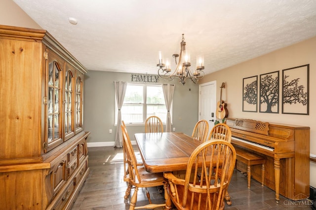 6290 Ludlum Rd, Salem Twp, OH 45152 - dining area featuring a chandelier, baseboards, a textured ceiling, and dark wood-style floors