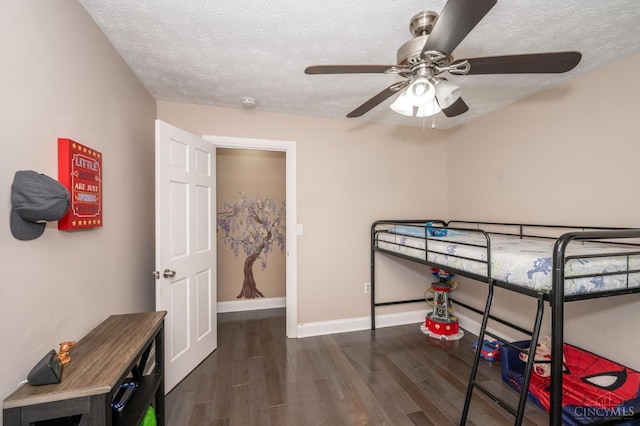 6290 Ludlum Rd, Salem Twp, OH 45152 - bedroom with wood finished floors, a textured ceiling, baseboards, and a ceiling fan