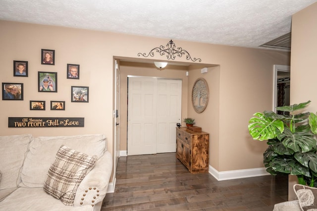 6290 Ludlum Rd, Salem Twp, OH 45152 - entrance foyer featuring baseboards, wood finished floors, and a textured ceiling