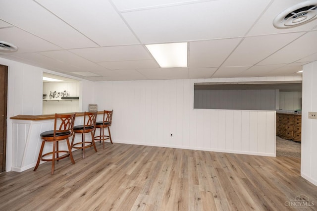6290 Ludlum Rd, Salem Twp, OH 45152 - finished basement featuring wood finished floors, a drop ceiling, bar, and baseboards
