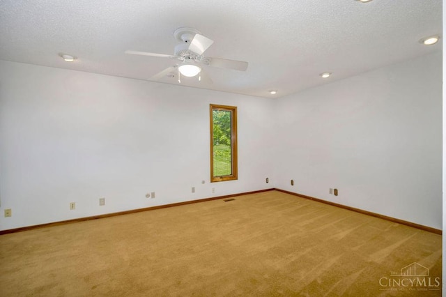 4723 Rosedale Rd, Middletown, OH 45042 - spare room with carpet flooring, baseboards, a ceiling fan, a textured ceiling, and recessed lighting