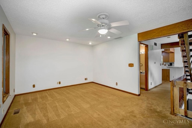 4723 Rosedale Rd, Middletown, OH 45042 - spare room featuring light carpet, a ceiling fan, a textured ceiling, baseboards, and recessed lighting