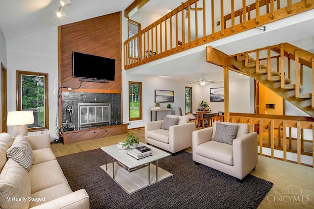 4723 Rosedale Rd, Middletown, OH 45042 - living area with high vaulted ceiling, a fireplace, healthy amount of natural light, stairway, and a ceiling fan
