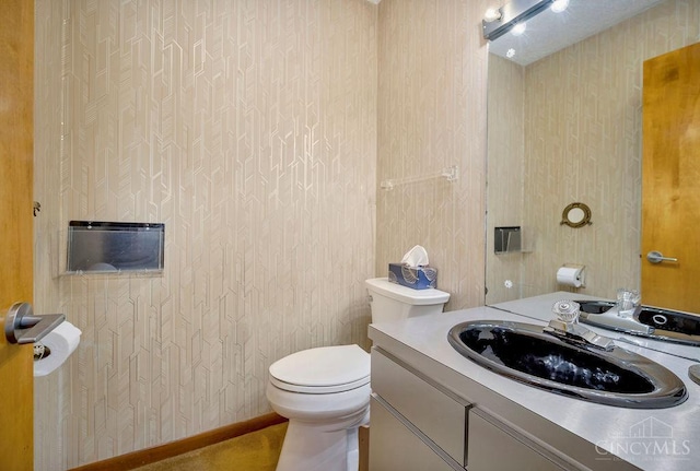 4723 Rosedale Rd, Middletown, OH 45042 - half bath featuring wallpapered walls, toilet, and vanity