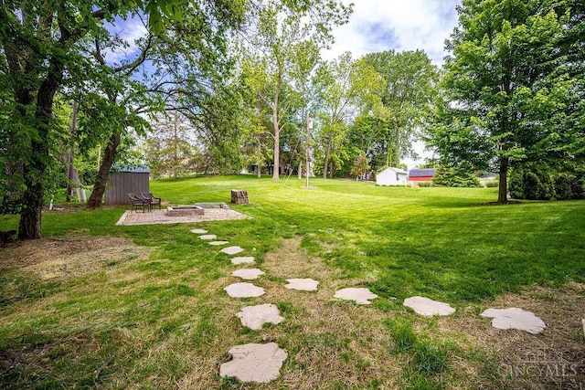 4723 Rosedale Rd, Middletown, OH 45042 - view of grassy yard featuring a fire pit