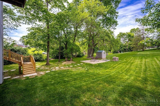 4723 Rosedale Rd, Middletown, OH 45042 - view of grassy yard featuring stairs, a wooden deck, and view of wooded area