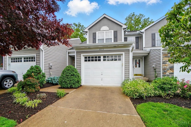 6872 Sandharbor Ct, Hamilton Twp, OH 45039 - traditional home featuring concrete driveway and an attached garage