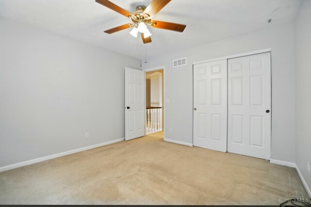 6872 Sandharbor Ct, Hamilton Twp, OH 45039 - unfurnished bedroom with light carpet, baseboards, a closet, and a ceiling fan