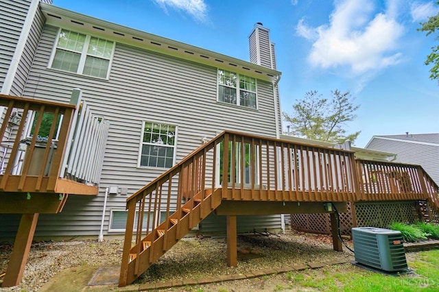 6872 Sandharbor Ct, Hamilton Twp, OH 45039 - back of property featuring central air condition unit, a wooden deck, a chimney, and stairway
