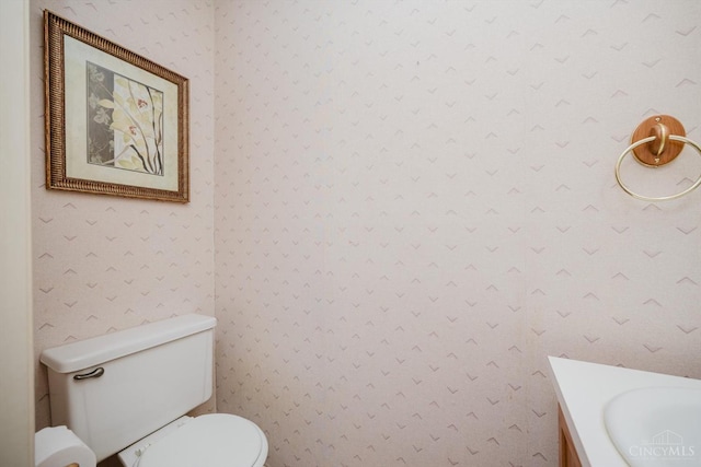 4634 Courtwood Cir, Union Twp, OH 45103 - half bath featuring wallpapered walls, toilet, and vanity