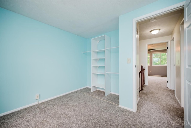 4634 Courtwood Cir, Union Twp, OH 45103 - unfurnished bedroom featuring carpet, baseboards, and a textured ceiling