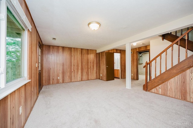 4634 Courtwood Cir, Union Twp, OH 45103 - below grade area with wood walls, carpet floors, stairs, and electric panel