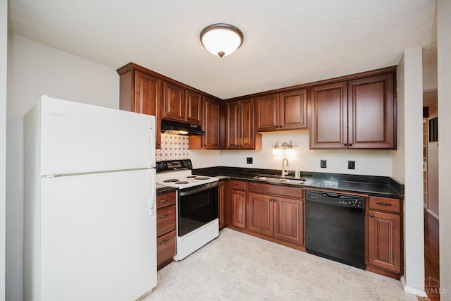 4634 Courtwood Cir, Union Twp, OH 45103 - kitchen featuring white appliances, a sink, dark countertops, under cabinet range hood, and light floors