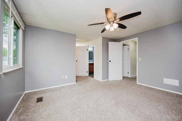 4634 Courtwood Cir, Union Twp, OH 45103 - unfurnished bedroom with carpet, baseboards, connected bathroom, and ceiling fan