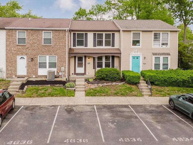 4634 Courtwood Cir, Union Twp, OH 45103 - view of property with uncovered parking and cooling unit