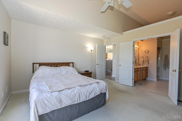6260 Lake Front, Mason, OH 45040 - bedroom with light carpet, baseboards, connected bathroom, vaulted ceiling, and ceiling fan