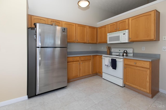 6260 Lake Front, Mason, OH 45040 - kitchen featuring white appliances, baseboards, and brown cabinetry