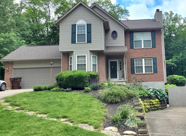 10773 New Biddinger Rd, Harrison Twp, OH 45030 - view of front of property featuring brick siding, a chimney, and a garage