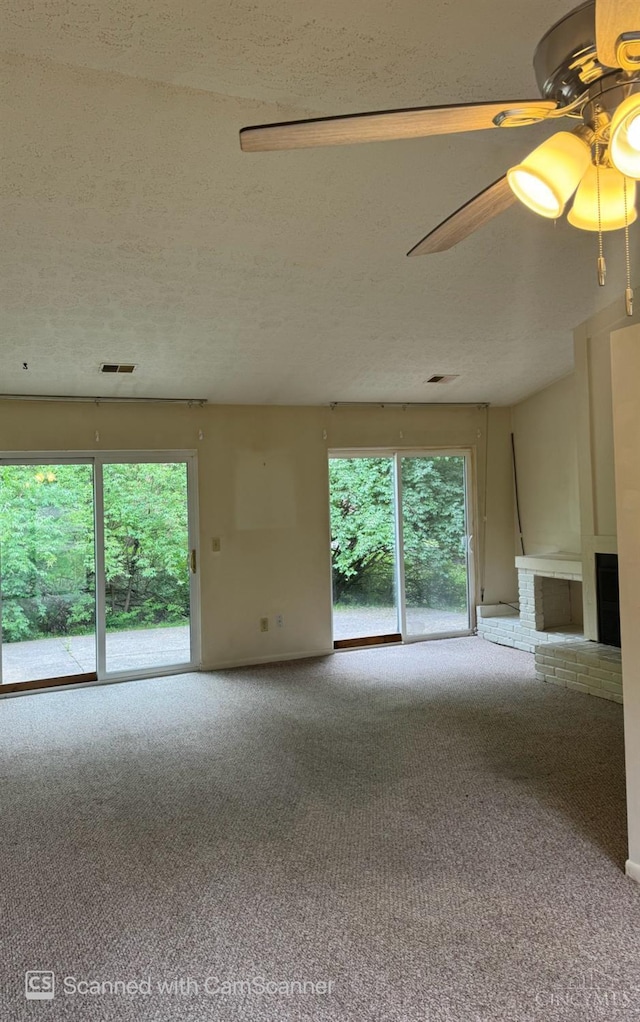 380 Walnut Ln, Mason, OH 45040 - empty room with healthy amount of natural light, carpet floors, a textured ceiling, and a ceiling fan