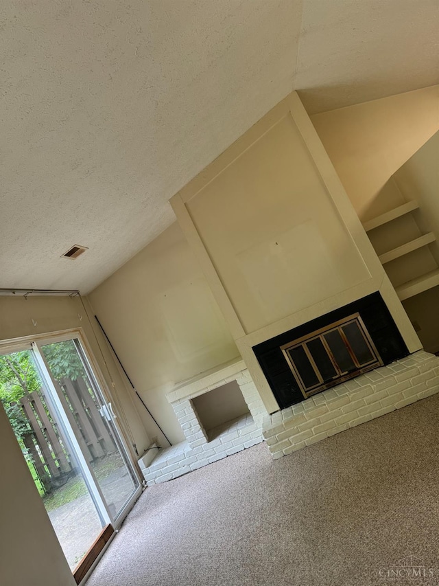 380 Walnut Ln, Mason, OH 45040 - detailed view of a brick fireplace, a textured ceiling, and carpet flooring