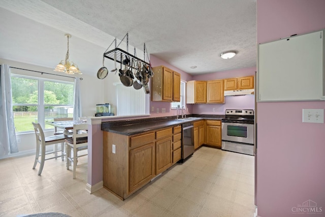 2489 Swings Corner Pt Isabel Rd, Tate Twp, OH 45106 - kitchen with appliances with stainless steel finishes, light flooring, under cabinet range hood, a textured ceiling, and a chandelier