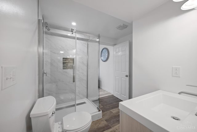 2489 Swings Corner Pt Isabel Rd, Tate Twp, OH 45106 - full bathroom featuring toilet, a marble finish shower, vanity, wood finished floors, and recessed lighting