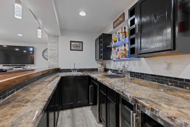 2489 Swings Corner Pt Isabel Rd, Tate Twp, OH 45106 - indoor wet bar featuring light wood finished floors, recessed lighting, and pendant lighting