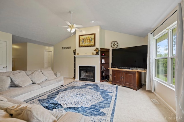 2489 Swings Corner Pt Isabel Rd, Tate Twp, OH 45106 - living room featuring light colored carpet, lofted ceiling, plenty of natural light, a ceiling fan, and a fireplace