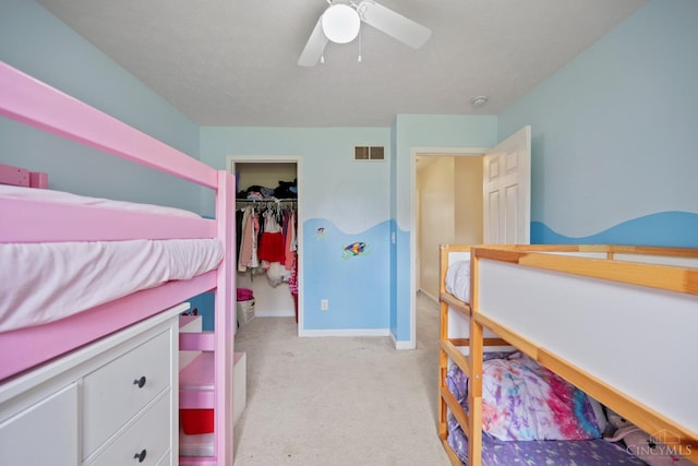 2489 Swings Corner Pt Isabel Rd, Tate Twp, OH 45106 - bedroom featuring light carpet, baseboards, ceiling fan, and a walk in closet