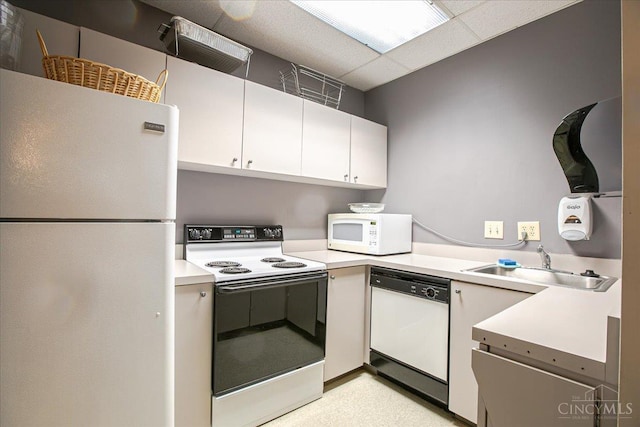 2324 Madison Rd Unit 506, Cincinnati, OH 45208 - kitchen with white appliances, a sink, light countertops, and white cabinets