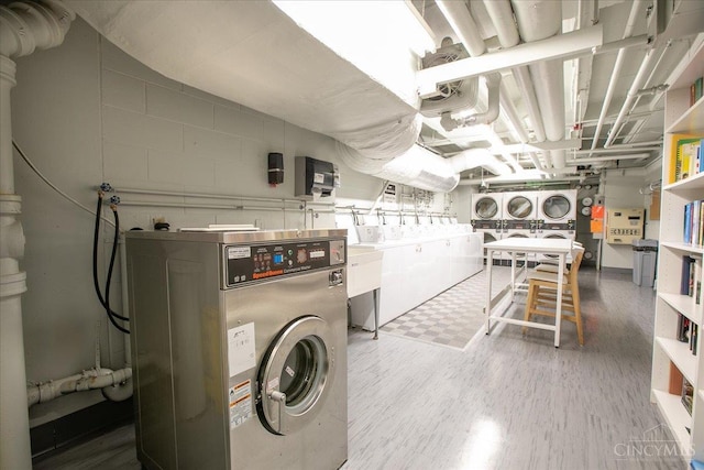 2324 Madison Rd Unit 506, Cincinnati, OH 45208 - washroom featuring separate washer and dryer and concrete block wall