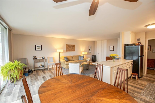 2324 Madison Rd Unit 506, Cincinnati, OH 45208 - dining area with light wood-style floors and ceiling fan