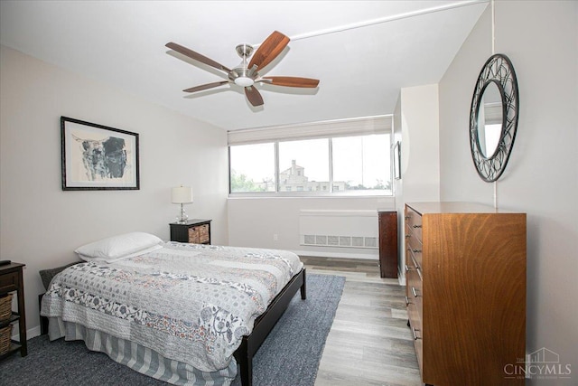2324 Madison Rd Unit 506, Cincinnati, OH 45208 - bedroom featuring wood finished floors, baseboards, and a ceiling fan