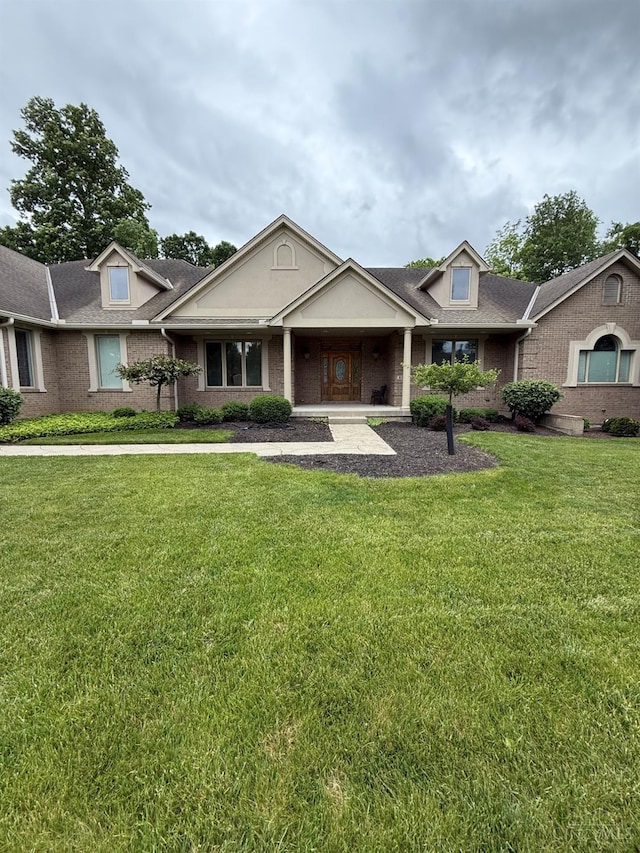655 Devanshae Ct, Hamilton, OH 45013 - view of front of house featuring a front lawn and brick siding