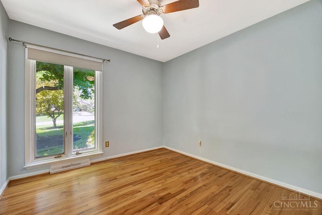 8714 Wuest Rd, Colerain Twp, OH 45251 - spare room featuring light wood-style floors, baseboards, and a ceiling fan