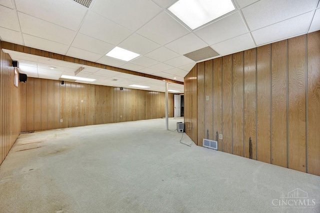 8714 Wuest Rd, Colerain Twp, OH 45251 - finished basement featuring wood walls, carpet flooring, and a paneled ceiling