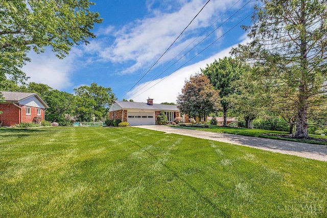 8714 Wuest Rd, Colerain Twp, OH 45251 - view of front facade featuring concrete driveway, a front lawn, a garage, and brick siding