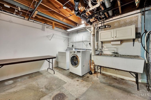 8714 Wuest Rd, Colerain Twp, OH 45251 - washroom featuring cabinet space and separate washer and dryer