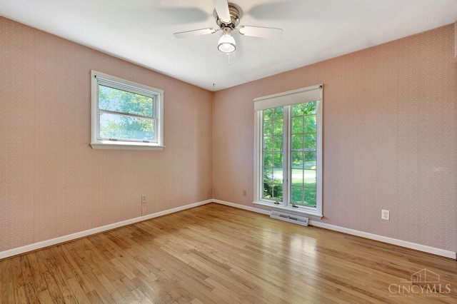 8714 Wuest Rd, Colerain Twp, OH 45251 - empty room featuring light wood-style floors, baseboards, and ceiling fan
