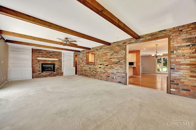 8714 Wuest Rd, Colerain Twp, OH 45251 - unfurnished living room with carpet flooring, a chandelier, a brick fireplace, ceiling fan, and beam ceiling