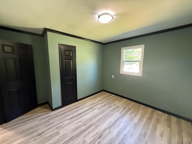 5776 State Route 132, Stonelick Twp, OH 45103 - unfurnished room with crown molding, light wood-style flooring, and baseboards