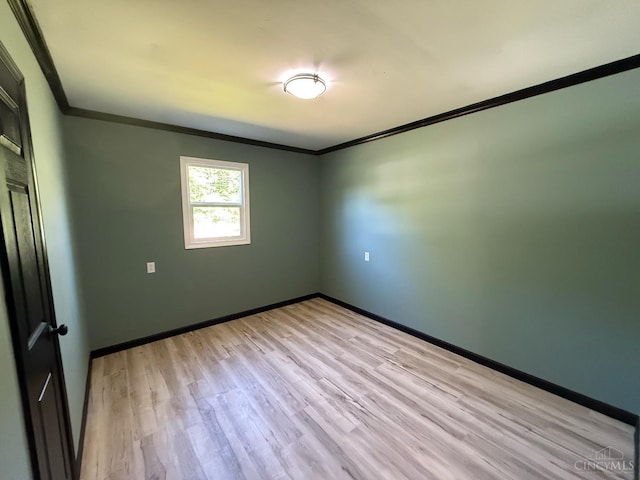 5776 State Route 132, Stonelick Twp, OH 45103 - empty room with crown molding, light wood-style flooring, and baseboards